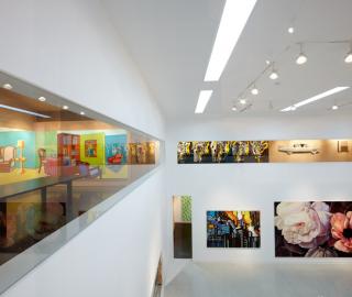 view from the upper galleries across the white cube space